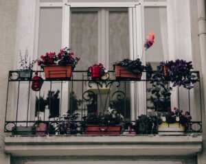 Home A picturesque balcony in Istanbul adorned with colorful potted plants, adding a touch of nature.